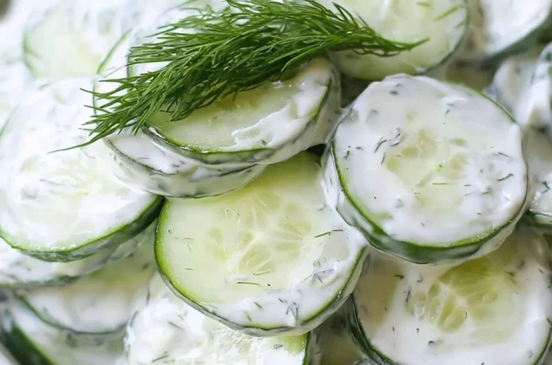 Creamy cucumber salad with onions and tangy sour cream dressing