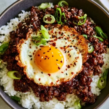 Korean Ground Beef Bowl with vegetables and rice on a plate