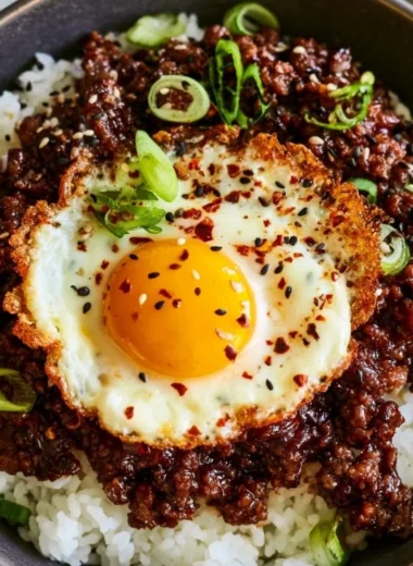 Korean Ground Beef Bowl with vegetables and rice on a plate