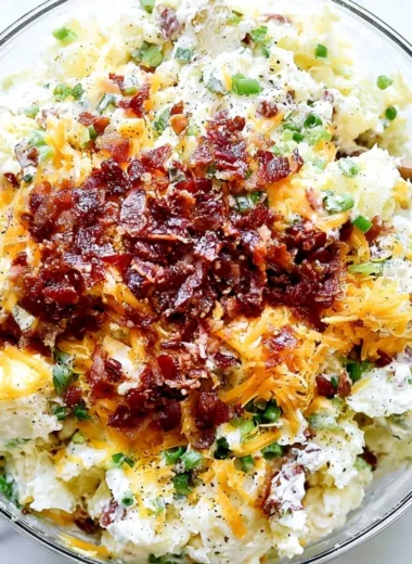 Delicious loaded baked potato salad with toppings in a bowl
