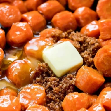 Maple glazed carrots served in a bowl, highlighting their glossy finish and vibrant color.