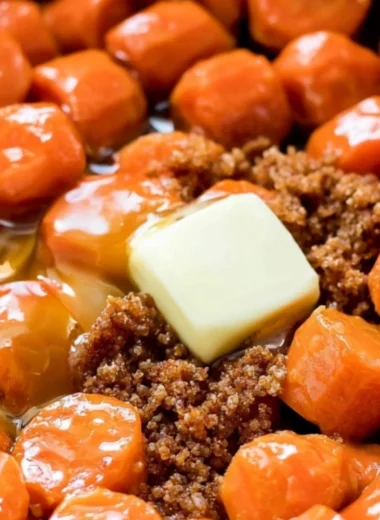Maple glazed carrots served in a bowl, highlighting their glossy finish and vibrant color.