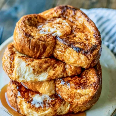 Delicious French toast served with syrup and fresh berries for breakfast