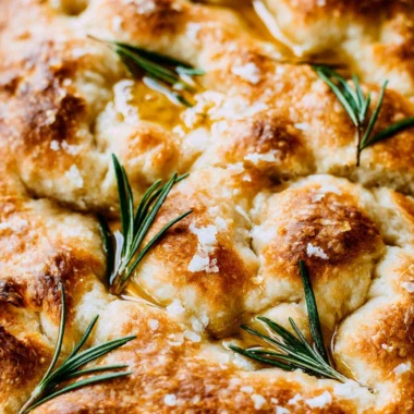 Freshly baked same day sourdough focaccia bread on a wooden board