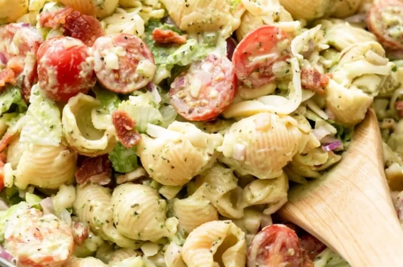Colorful BLT Pasta Salad with bacon, lettuce, and tomatoes in a bowl.