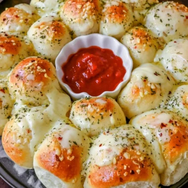 Cheesy garlic monkey bread fresh from the oven, golden and gooey.