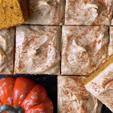 Delicious pumpkin spice latte cake topped with creamy frosting and autumn spices.